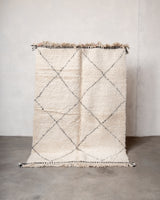 Modern, designer, handcrafted Berber rug from Morocco. Beniourain carpet with minimalist design, natural wool pile and a fluffy texture.