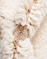 Modern, designer, handcrafted Berber rug from Morocco. Beniourain carpet with minimalist design, natural wool pile and a fluffy texture.