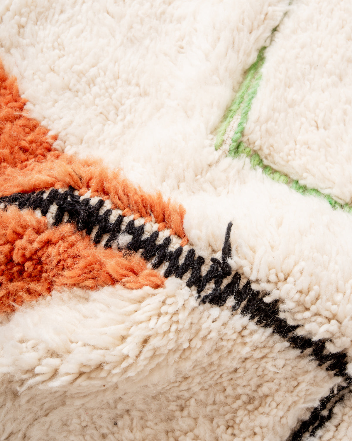 Modern, designer, handcrafted Berber rug from Morocco. Beniourain carpet with beautiful colours and patterns and fluffy wool texture.