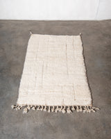 Modern, designer, handcrafted Berber rug from Morocco. Beniourain carpet with minimalist design, natural wool pile and a fluffy texture.
