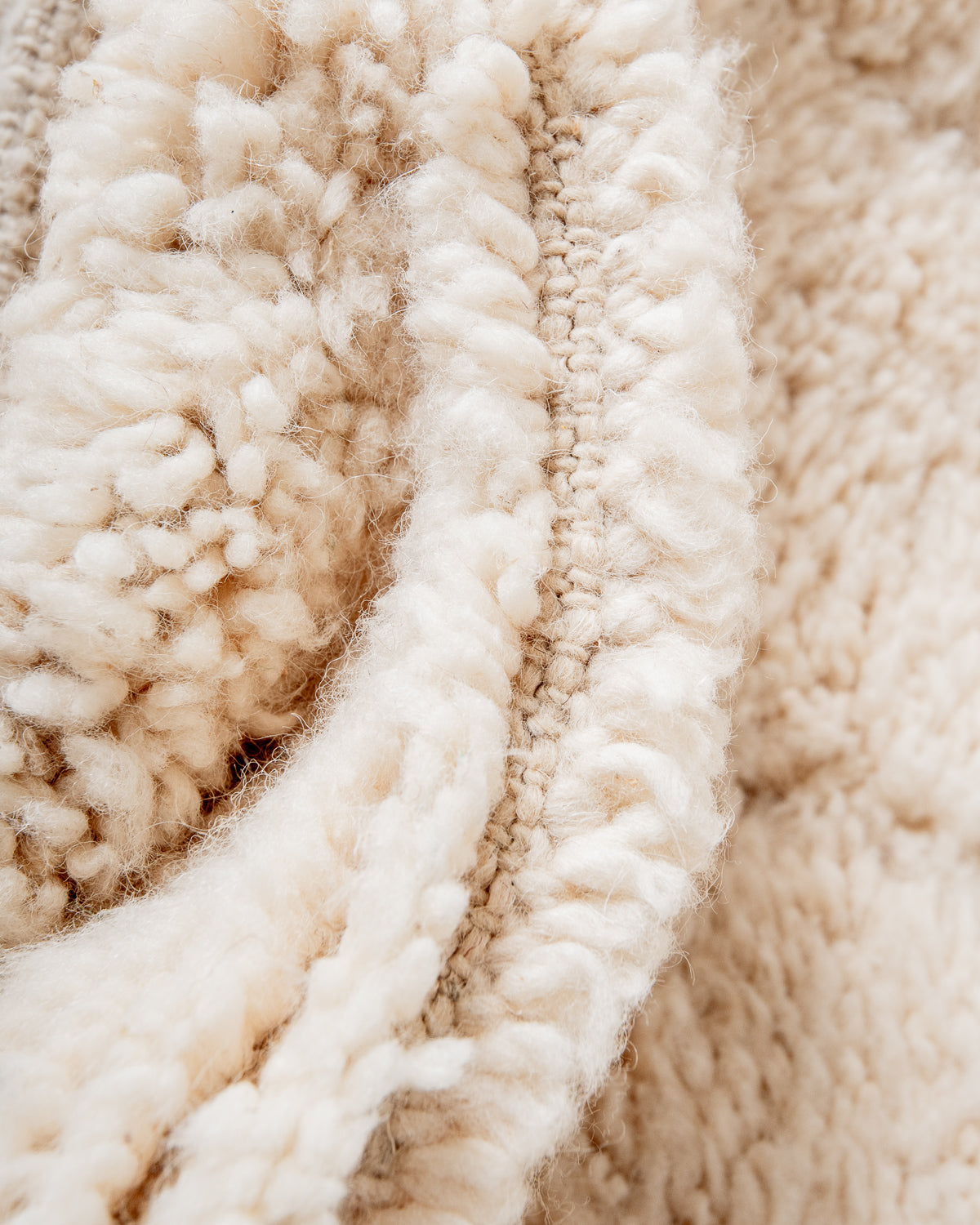 Modern, designer, handcrafted Berber rug from Morocco. Beniourain carpet with minimalist design, natural wool pile and a fluffy texture.