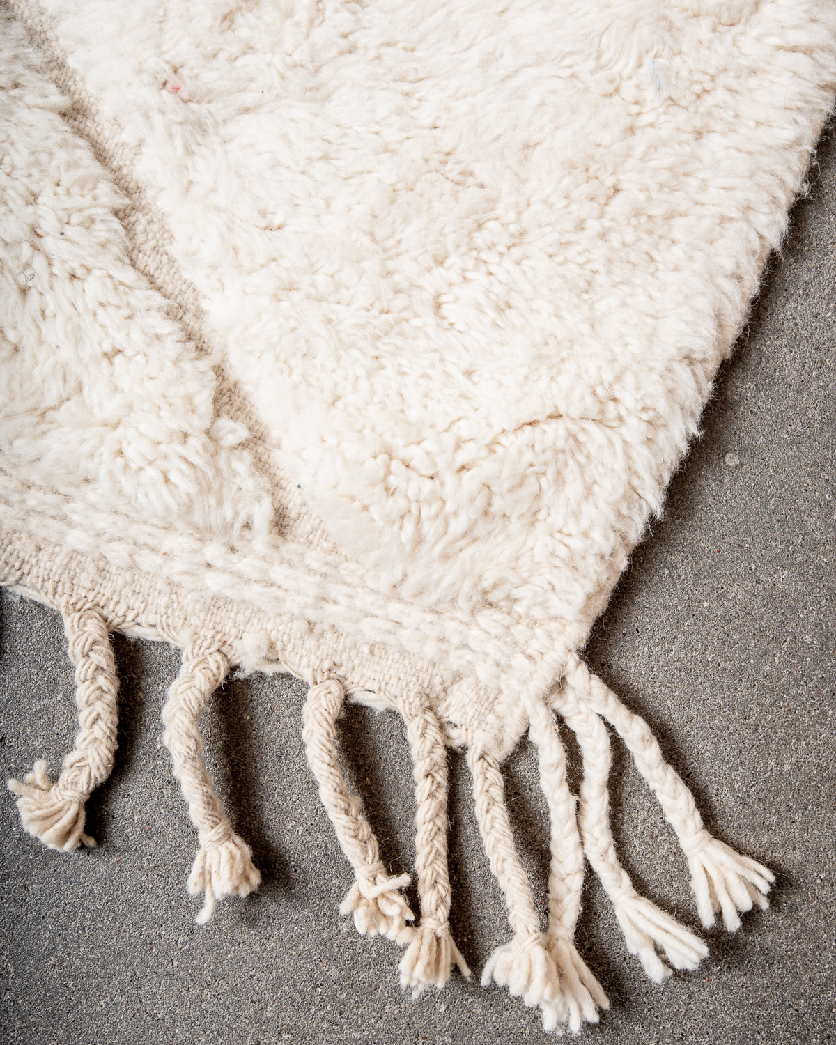 Modern, designer, handcrafted Berber rug from Morocco. Beniourain carpet with minimalist design, natural wool pile and a fluffy texture.