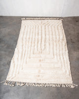 Modern, designer, handcrafted Berber rug from Morocco. Beniourain carpet with minimalist design, natural wool pile and a fluffy texture.