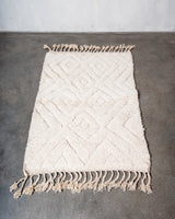 Modern, designer, handcrafted Berber rug from Morocco. Beniourain carpet with minimalist design, natural wool pile and a fluffy texture.