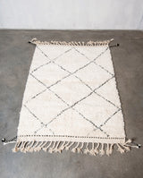 Modern, designer, handcrafted Berber rug from Morocco. Beniourain carpet with minimalist design, natural wool pile and a fluffy texture.