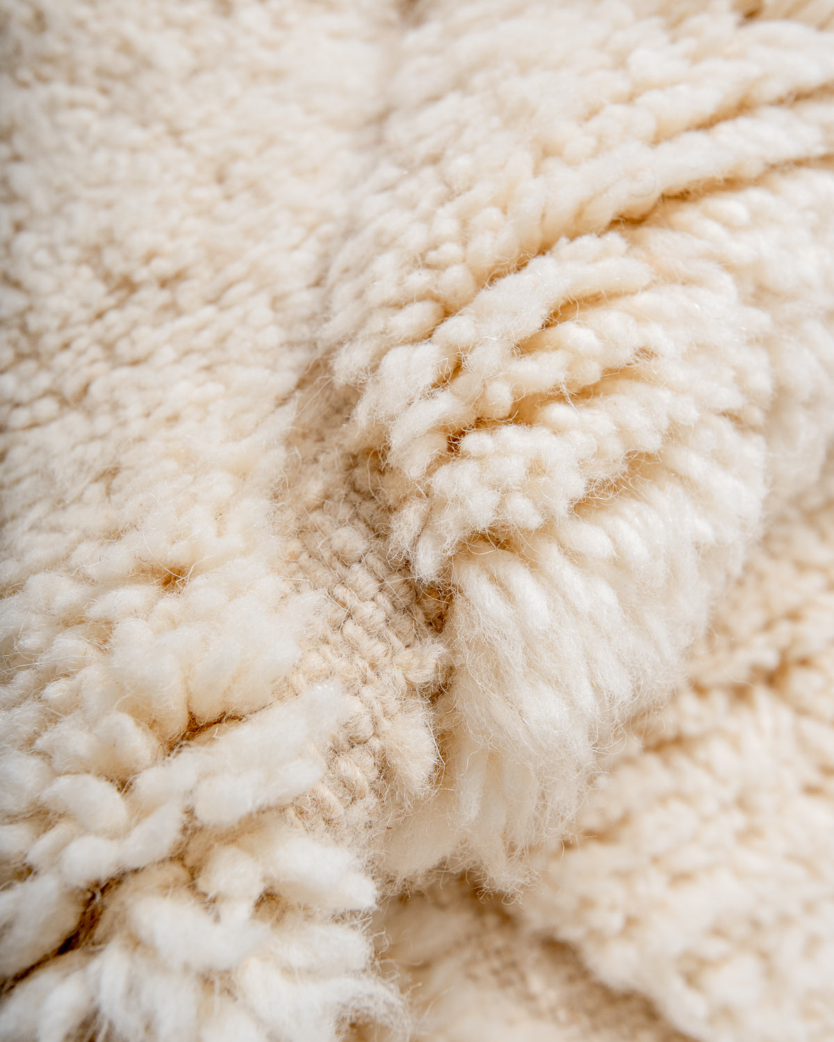 Modern, designer, handcrafted Berber rug from Morocco. Beniourain carpet with minimalist design, natural wool pile and a fluffy texture.