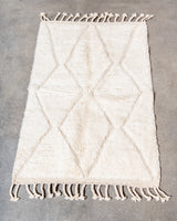 Modern, designer, handcrafted Berber rug from Morocco. Beniourain carpet with minimalist design, natural wool pile and a fluffy texture.