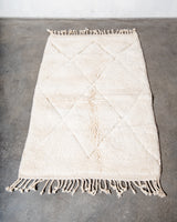 Modern, designer, handcrafted Berber rug from Morocco. Beniourain carpet with minimalist design, natural wool pile and a fluffy texture.