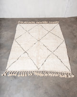 Modern, designer, handcrafted Berber rug from Morocco. Beniourain carpet with minimalist design, natural wool pile and a fluffy texture.