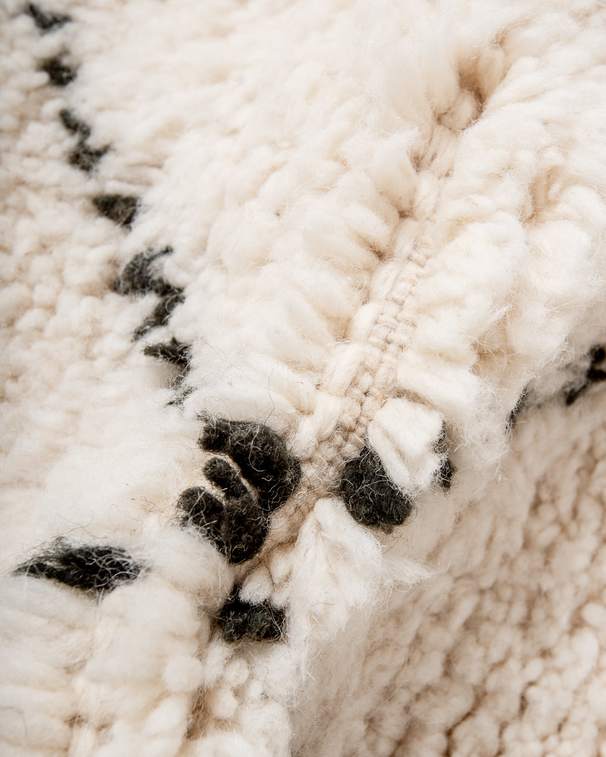 Modern, designer, handcrafted Berber rug from Morocco. Beniourain carpet with minimalist design, natural wool pile and a fluffy texture.