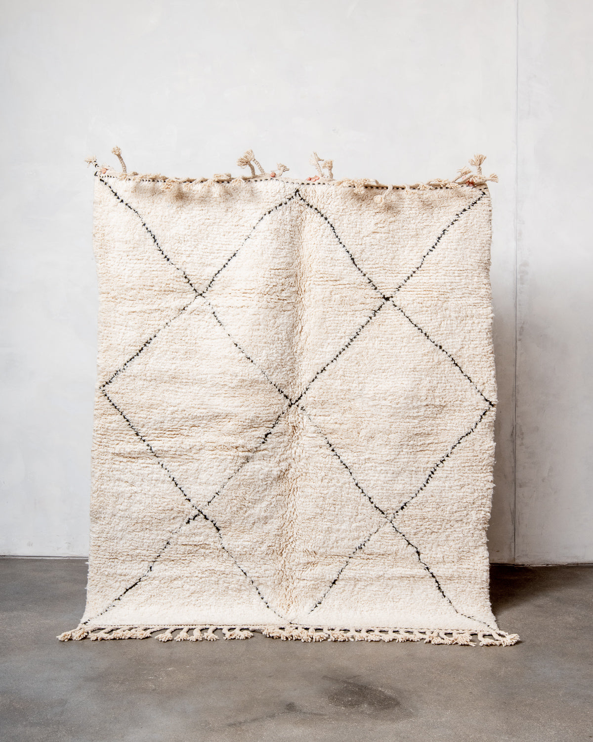 Modern, designer, handcrafted Berber rug from Morocco. Beniourain carpet with minimalist design, natural wool pile and a fluffy texture.