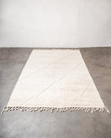 Modern, designer, handcrafted Berber rug from Morocco. Beniourain carpet with minimalist design, natural wool pile and a fluffy texture.