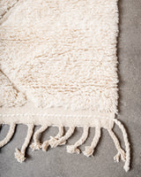Modern, designer, handcrafted Berber rug from Morocco. Beniourain carpet with minimalist design, natural wool pile and a fluffy texture.