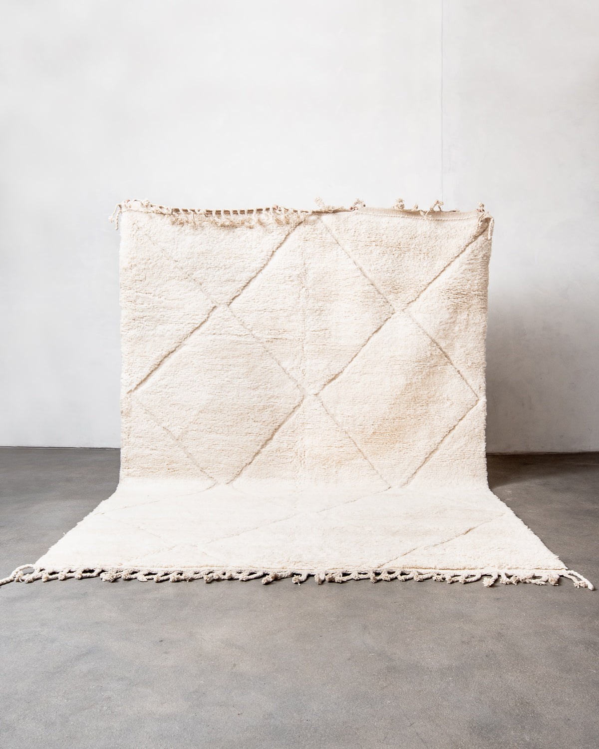 Modern, designer, handcrafted Berber rug from Morocco. Beniourain carpet with minimalist design, natural wool pile and a fluffy texture.