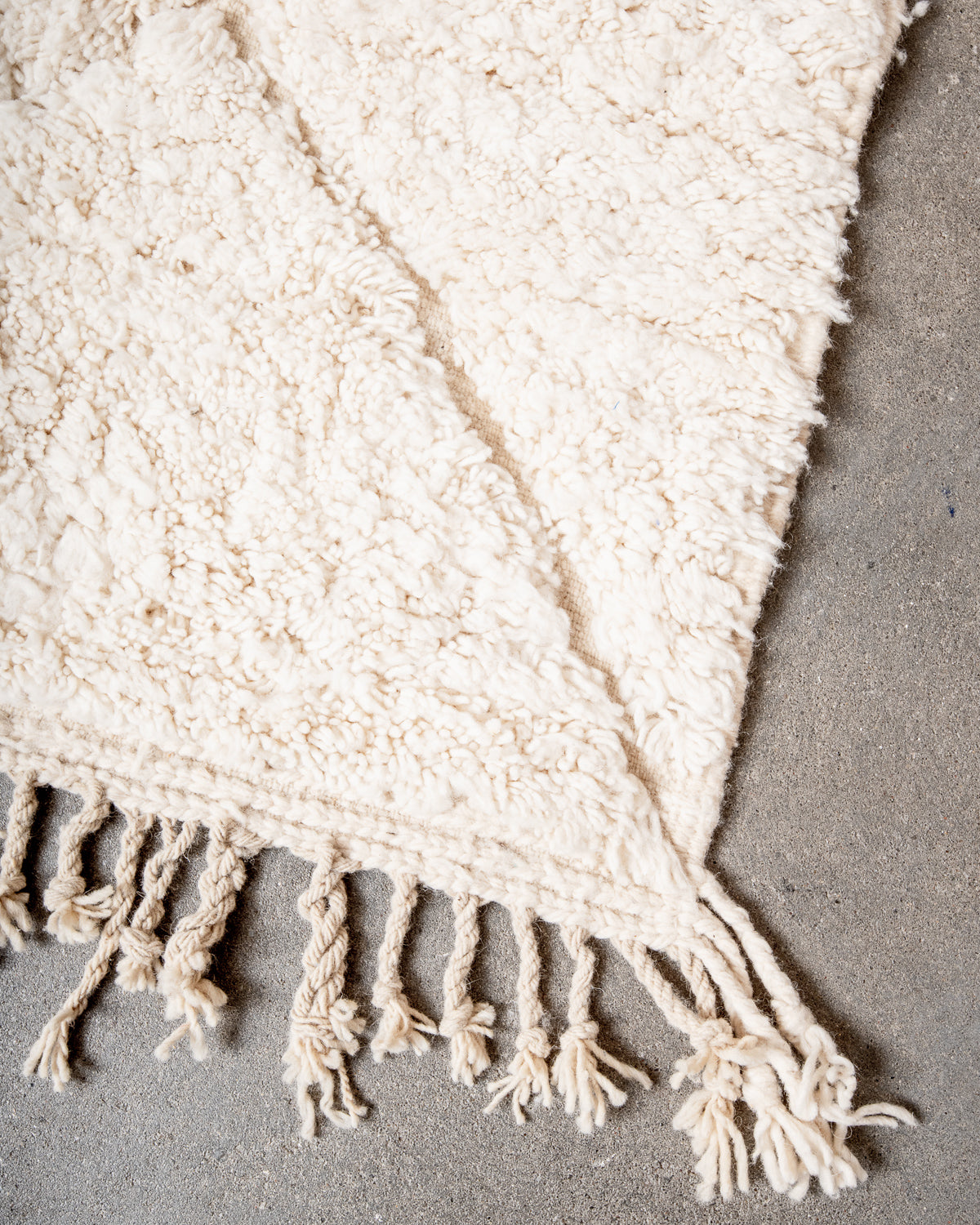 Modern, designer, handcrafted Berber rug from Morocco. Beniourain carpet with minimalist design, natural wool pile and a fluffy texture.