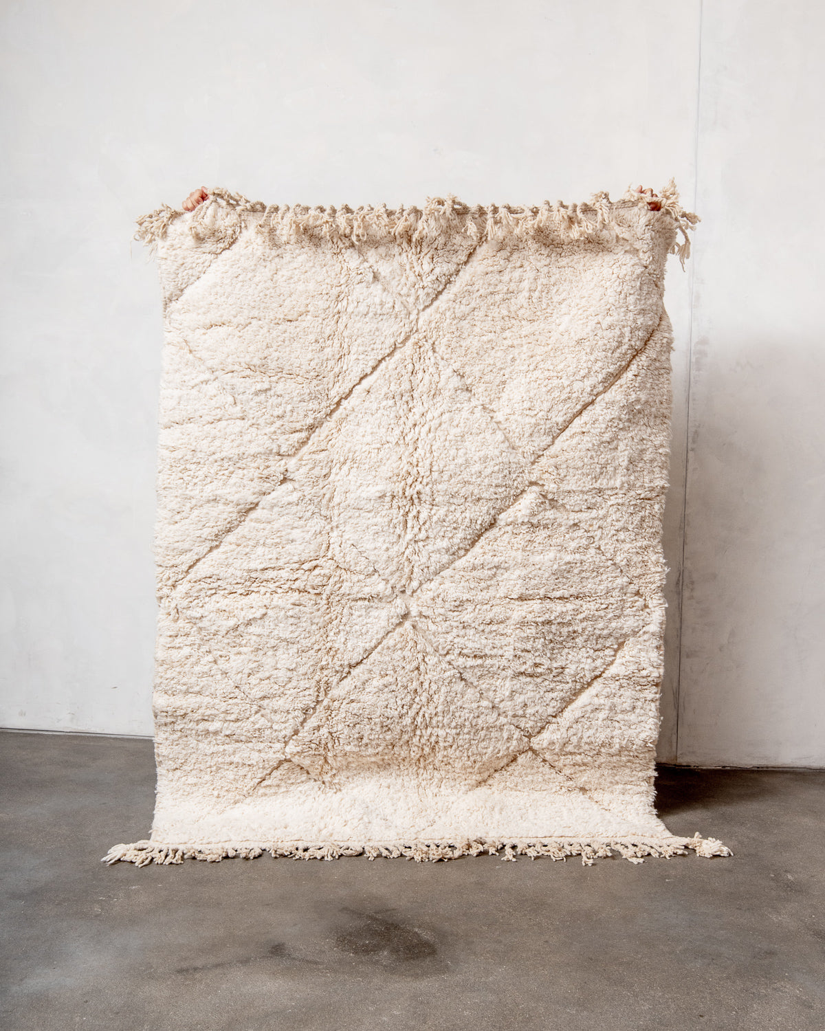 Modern, designer, handcrafted Berber rug from Morocco. Beniourain carpet with minimalist design, natural wool pile and a fluffy texture.