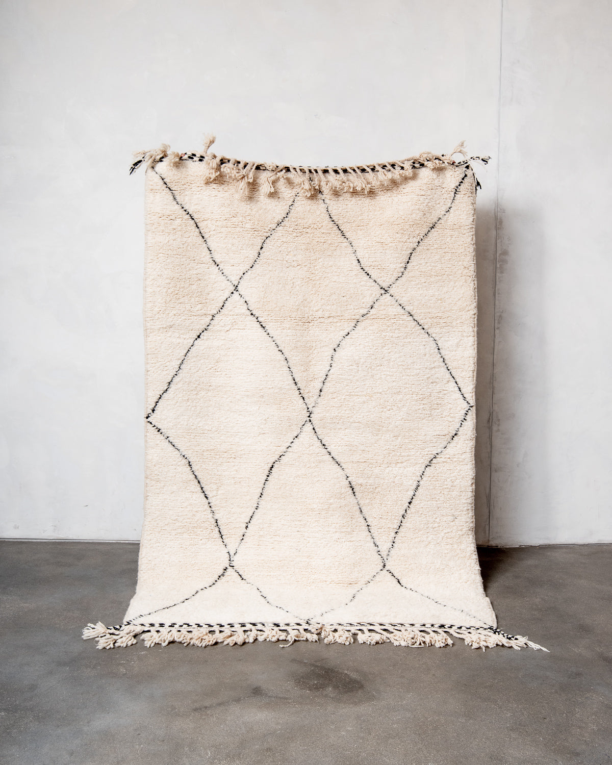 Modern, designer, handcrafted Berber rug from Morocco. Beniourain carpet with minimalist design, natural wool pile and a fluffy texture.