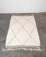 Modern, designer, handcrafted Berber rug from Morocco. Beniourain carpet with minimalist design, natural wool pile and a fluffy texture.