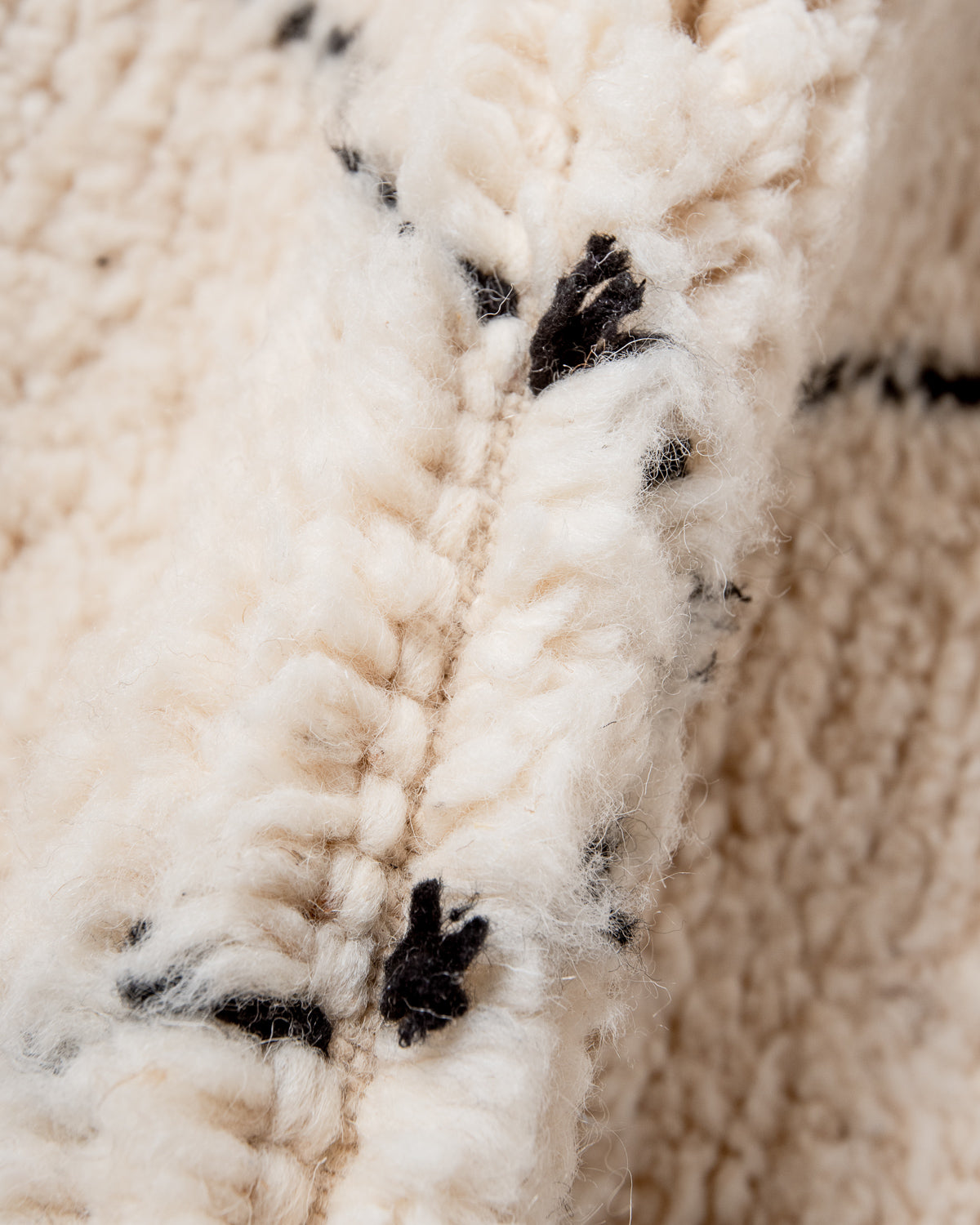 Modern, designer, handcrafted Berber rug from Morocco. Beniourain carpet with minimalist design, natural wool pile and a fluffy texture.