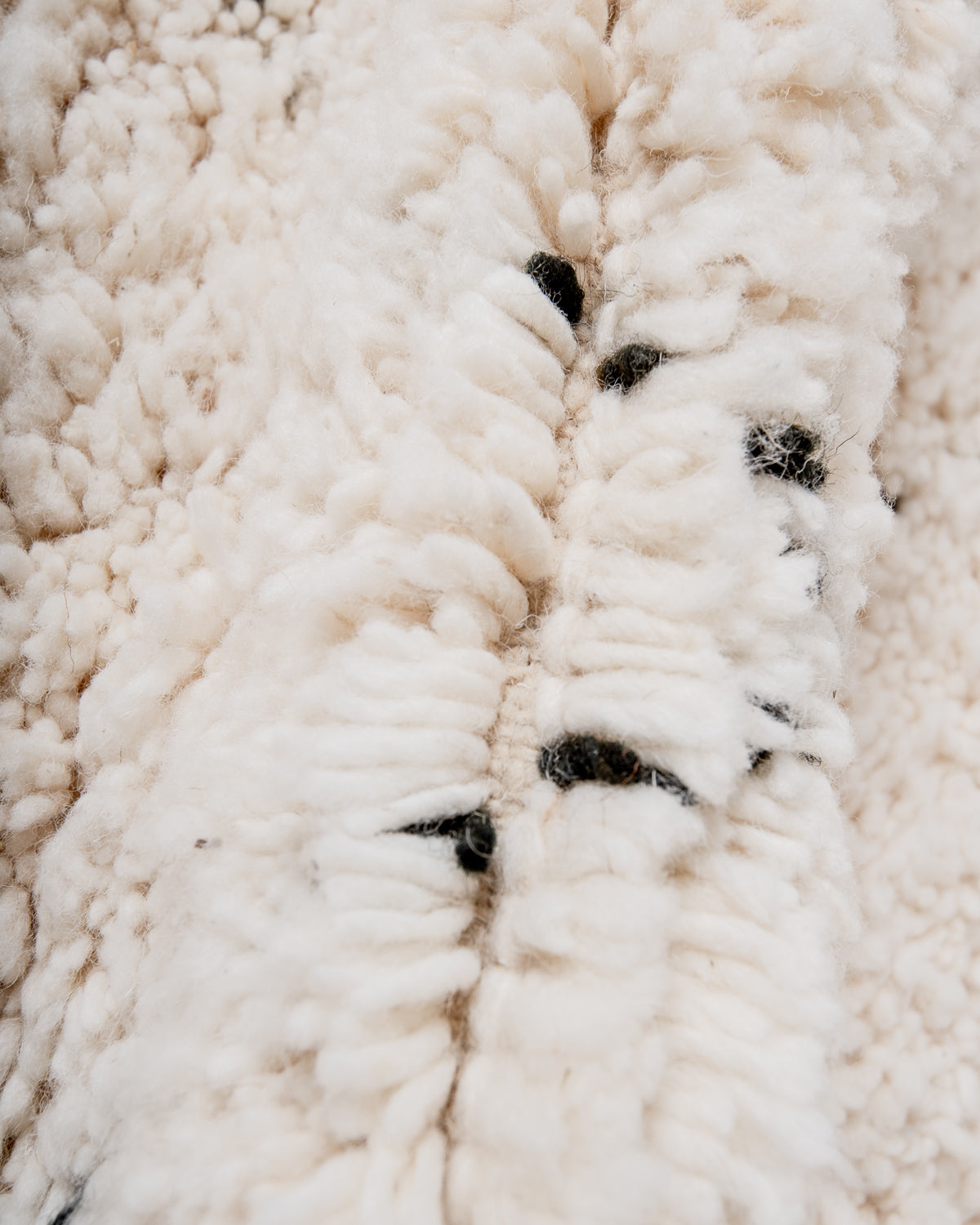 Modern, designer, handcrafted Berber rug from Morocco. Beniourain carpet with minimalist design, natural wool pile and a fluffy texture.