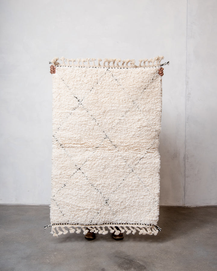 Modern, designer, handcrafted Berber rug from Morocco. Beniourain carpet with minimalist design, natural wool pile and a fluffy texture.