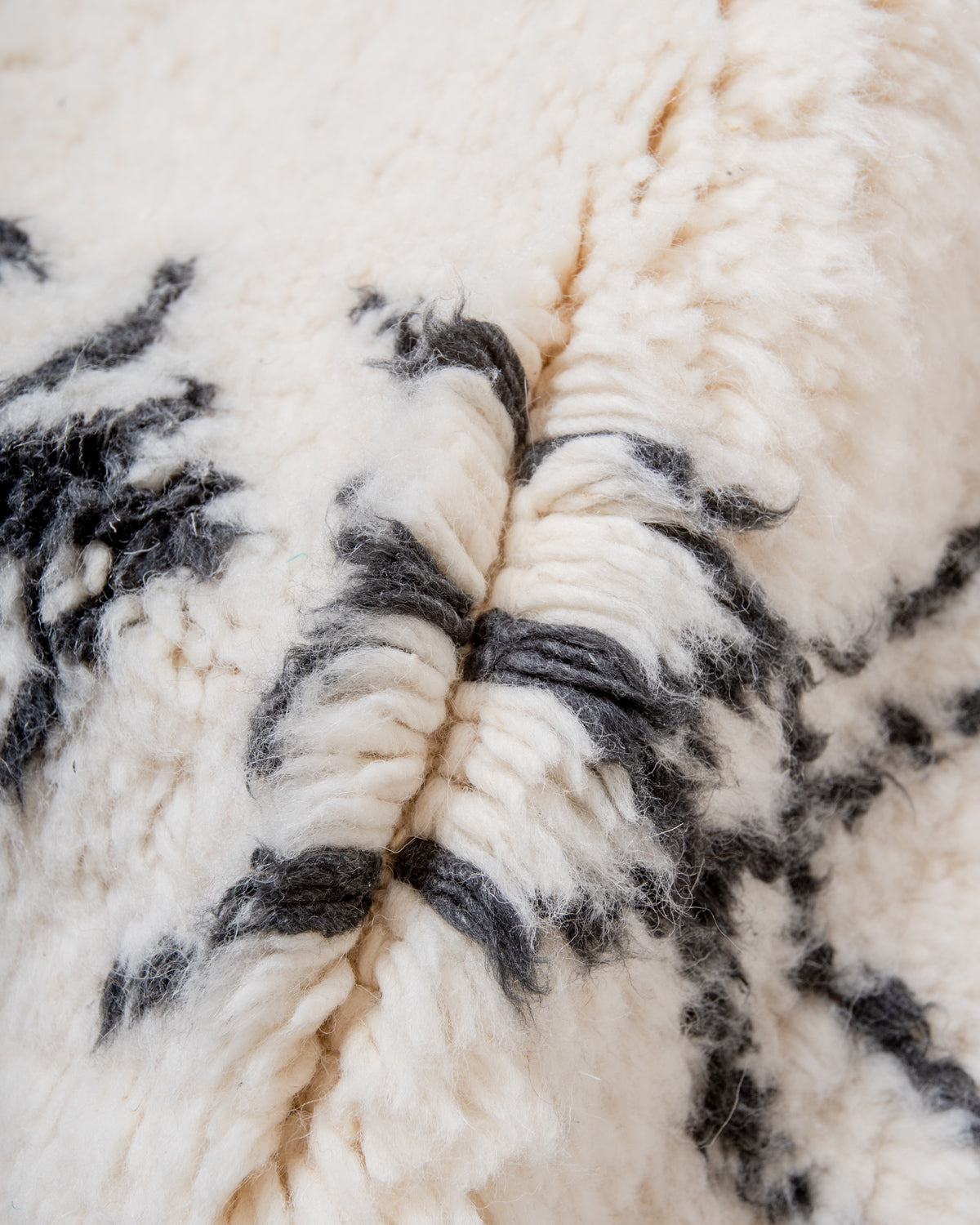 Modern, designer, handcrafted Berber rug from Morocco. Beniourain carpet with minimalist design, natural wool pile and a fluffy texture.