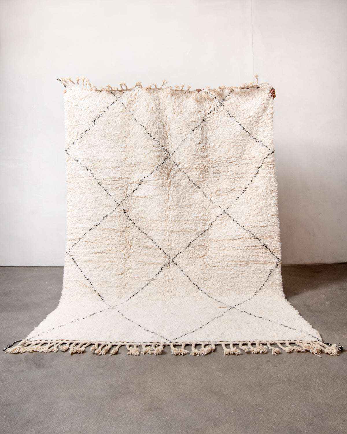 Modern, designer, handcrafted Berber rug from Morocco. Beniourain carpet with minimalist design, natural wool pile and a fluffy texture.