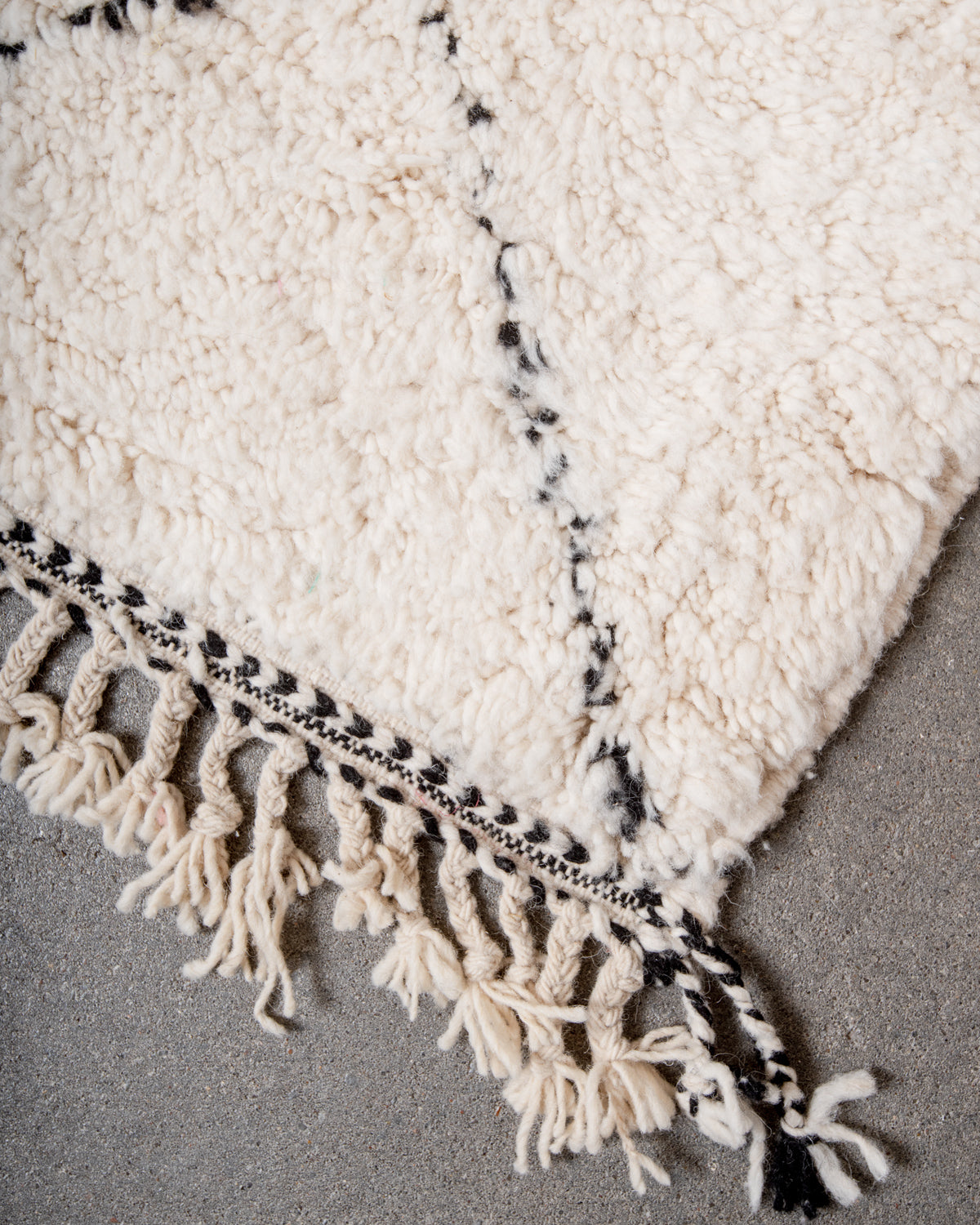 Modern, designer, handcrafted Berber rug from Morocco. Beniourain carpet with minimalist design, natural wool pile and a fluffy texture.