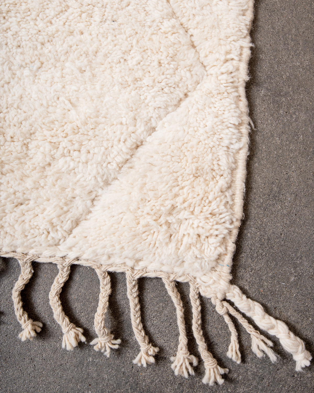 Modern, designer, handcrafted Berber rug from Morocco. Beniourain carpet with minimalist design, natural wool pile and a fluffy texture.