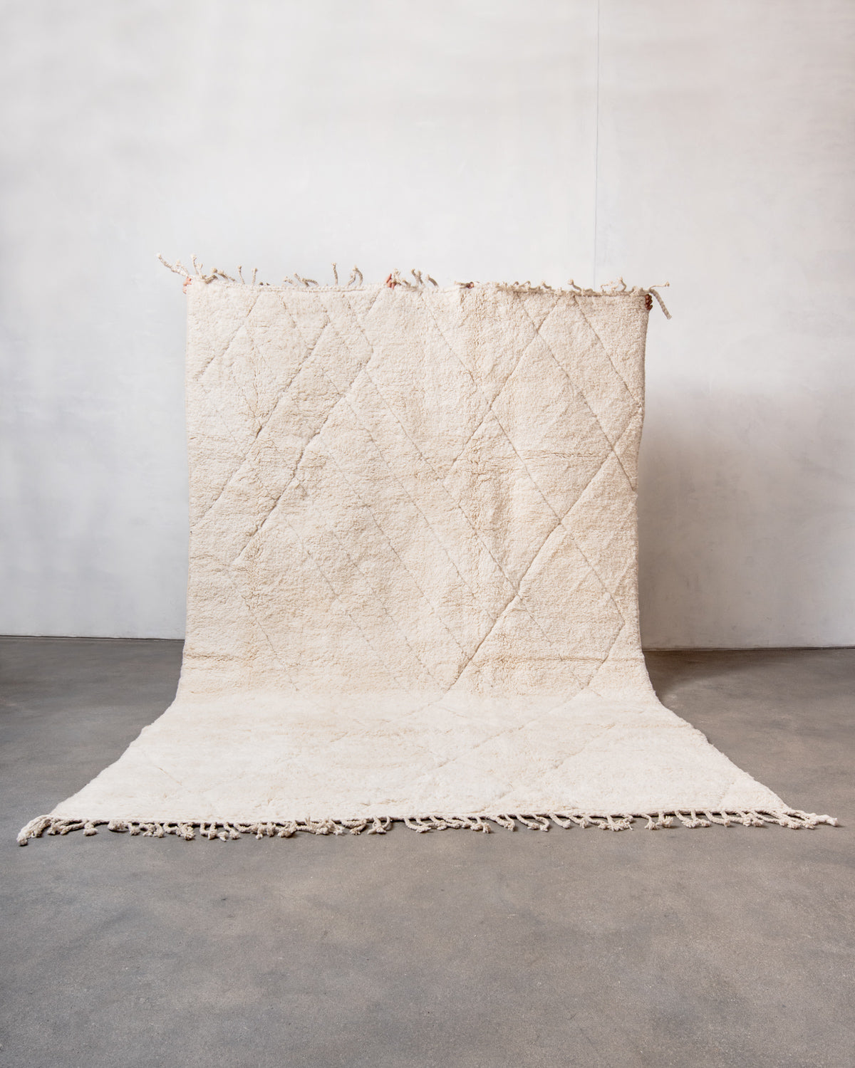 Modern, designer, handcrafted Berber rug from Morocco. Beniourain carpet with minimalist design, natural wool pile and a fluffy texture.