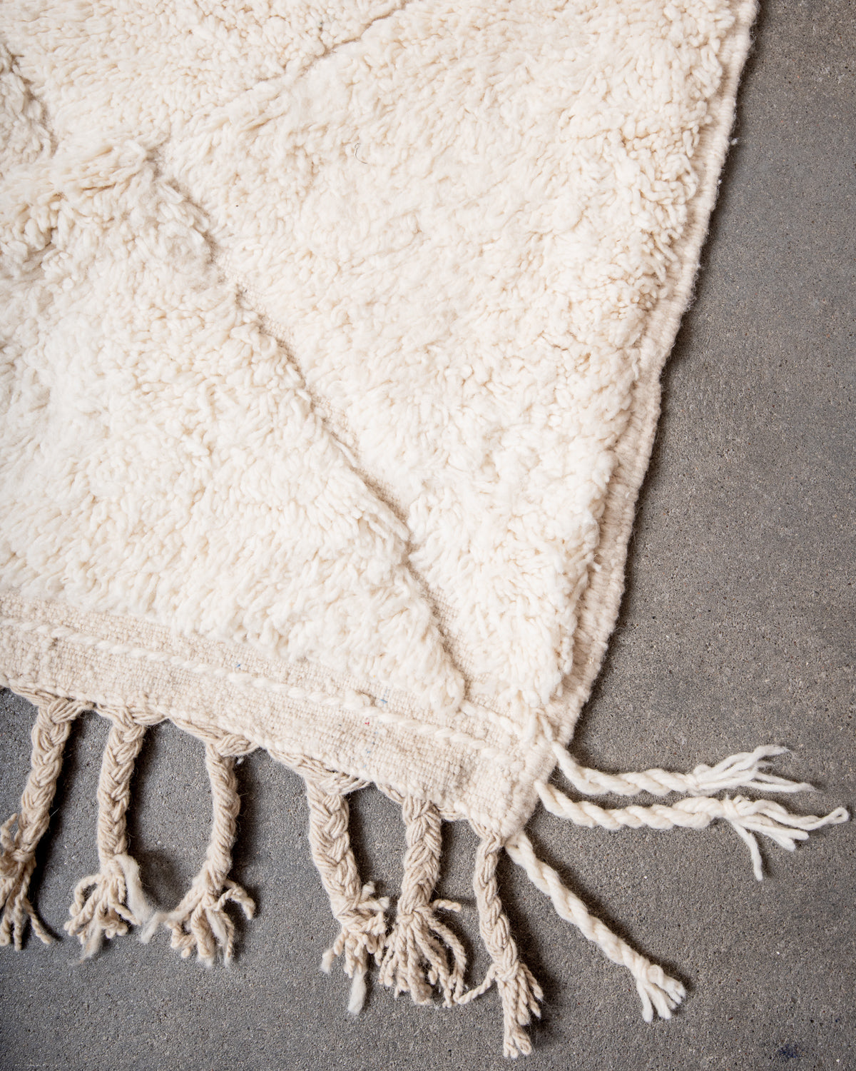 Modern, designer, handcrafted Berber rug from Morocco. Beniourain carpet with minimalist design, natural wool pile and a fluffy texture.