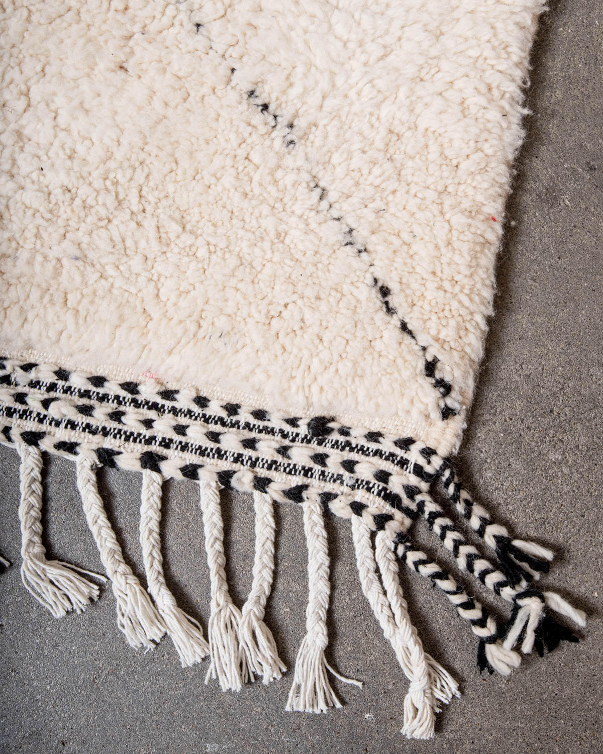Modern, designer, handcrafted Berber rug from Morocco. Beniourain carpet with minimalist design, natural wool pile and a fluffy texture.