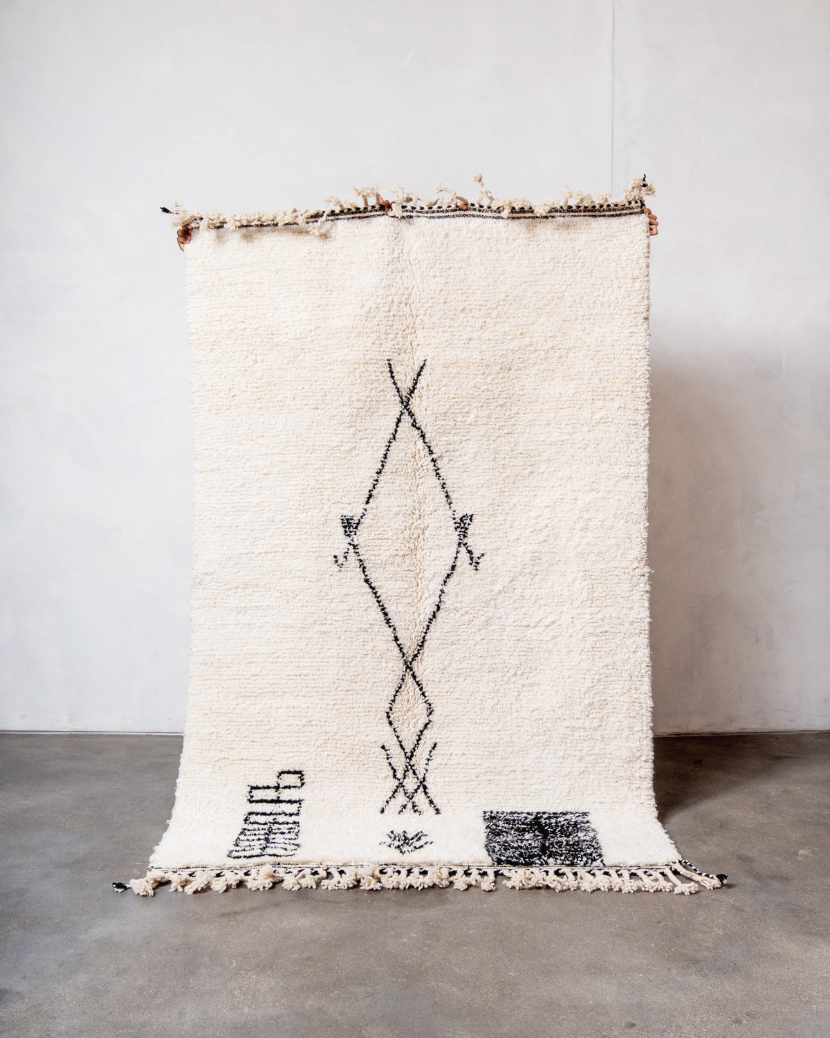 Modern, designer, handcrafted Berber rug from Morocco. Beniourain carpet with minimalist design, natural wool pile and a fluffy texture.