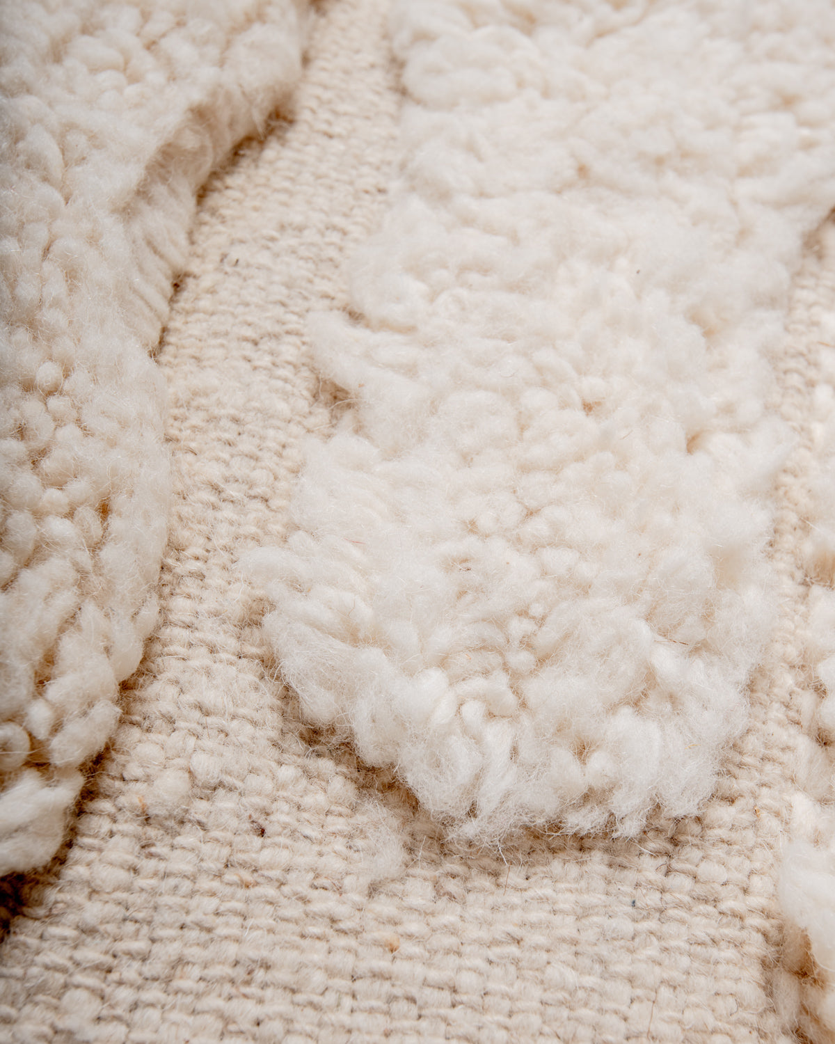 Modern, designer, handcrafted Berber rug from Morocco. Beniourain carpet with minimalist design, natural wool pile and a fluffy texture.