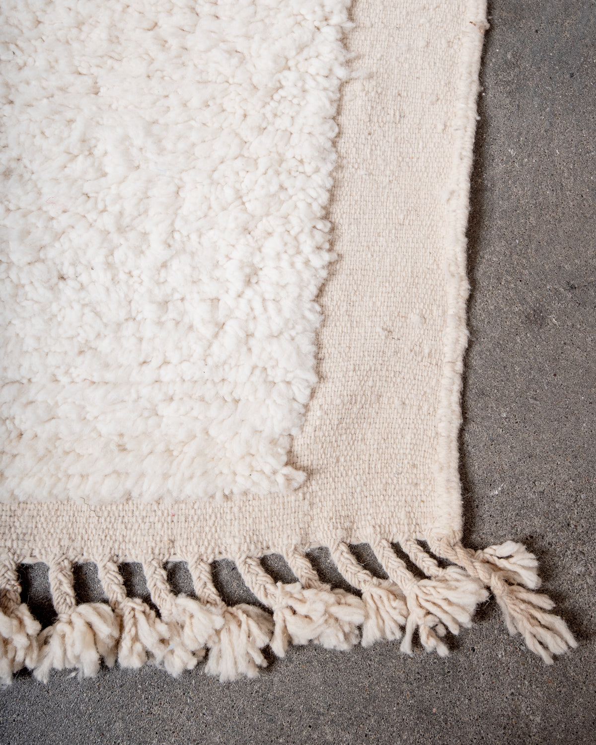 Modern, designer, handcrafted Berber rug from Morocco. Beniourain carpet with minimalist design, natural wool pile and a fluffy texture.