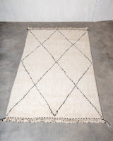 Modern, designer, handcrafted Berber rug from Morocco. Beniourain carpet with minimalist design, natural wool pile and a fluffy texture.