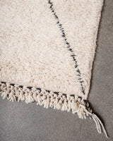 Modern, designer, handcrafted Berber rug from Morocco. Beniourain carpet with minimalist design, natural wool pile and a fluffy texture.