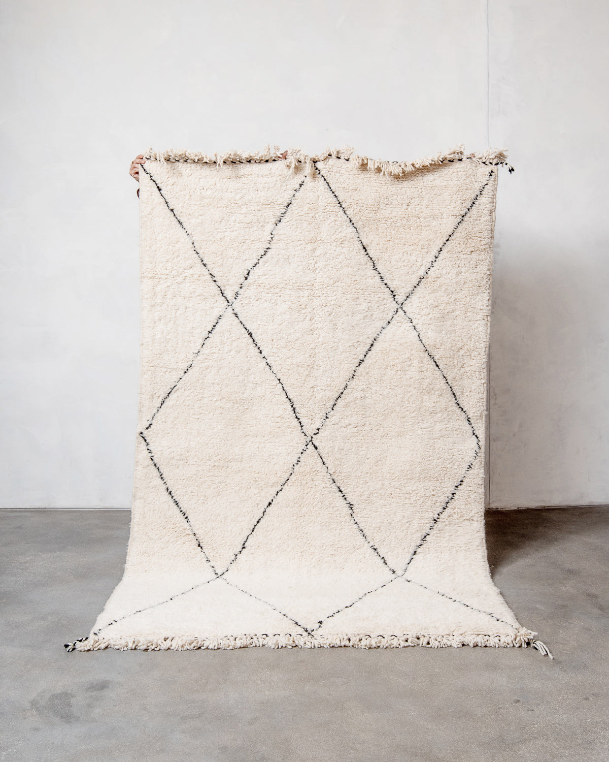 Modern, designer, handcrafted Berber rug from Morocco. Beniourain carpet with minimalist design, natural wool pile and a fluffy texture.