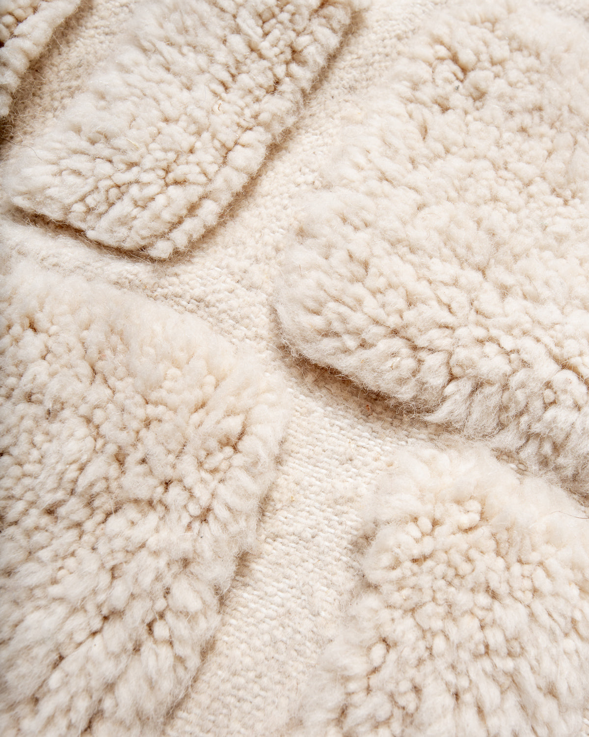 Modern, designer, handcrafted Berber rug from Morocco. Beniourain carpet with minimalist design, natural wool pile and a fluffy texture.