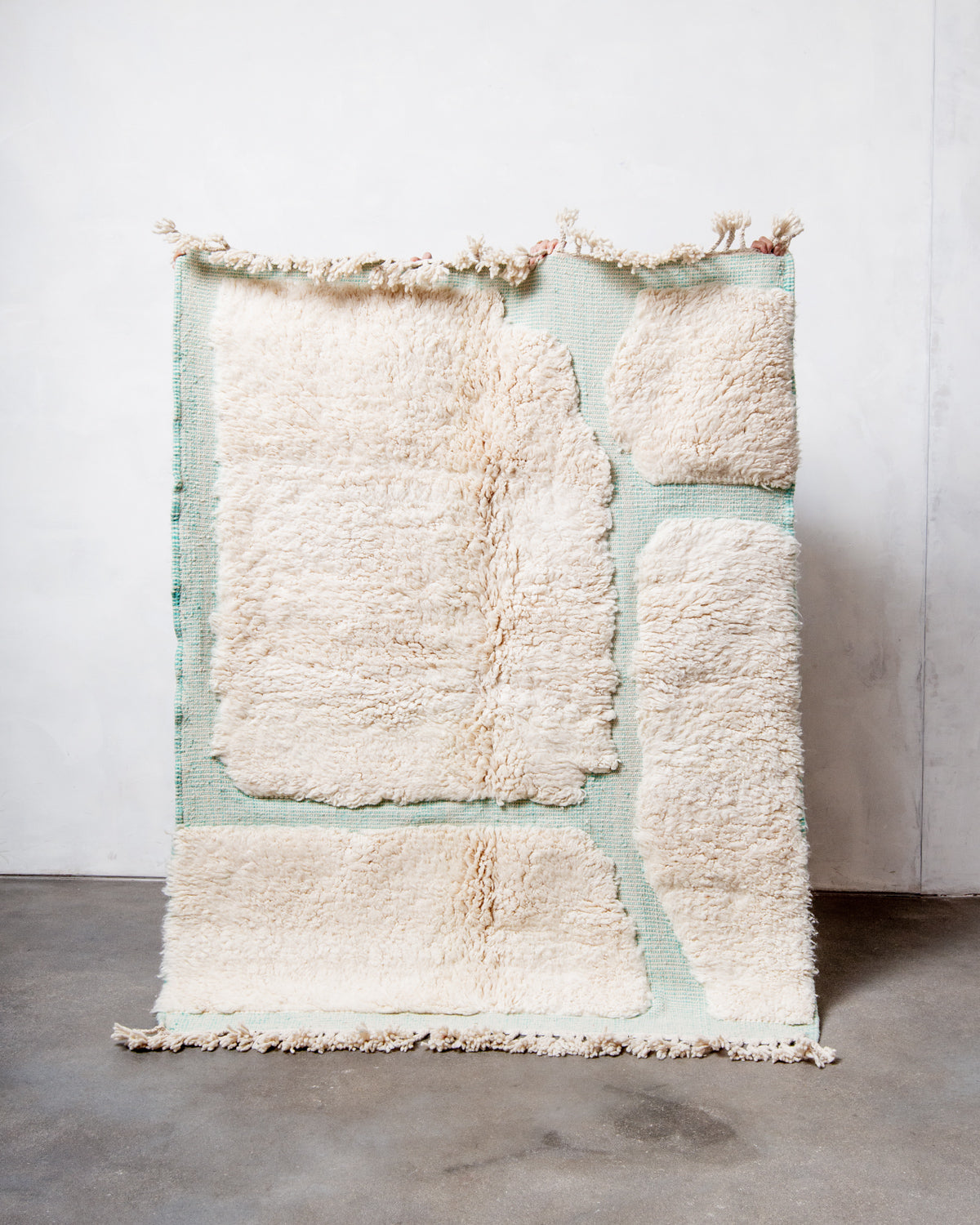 Modern, designer, handcrafted Berber rug from Morocco. Beniourain carpet with minimalist design, natural wool pile and a fluffy texture.