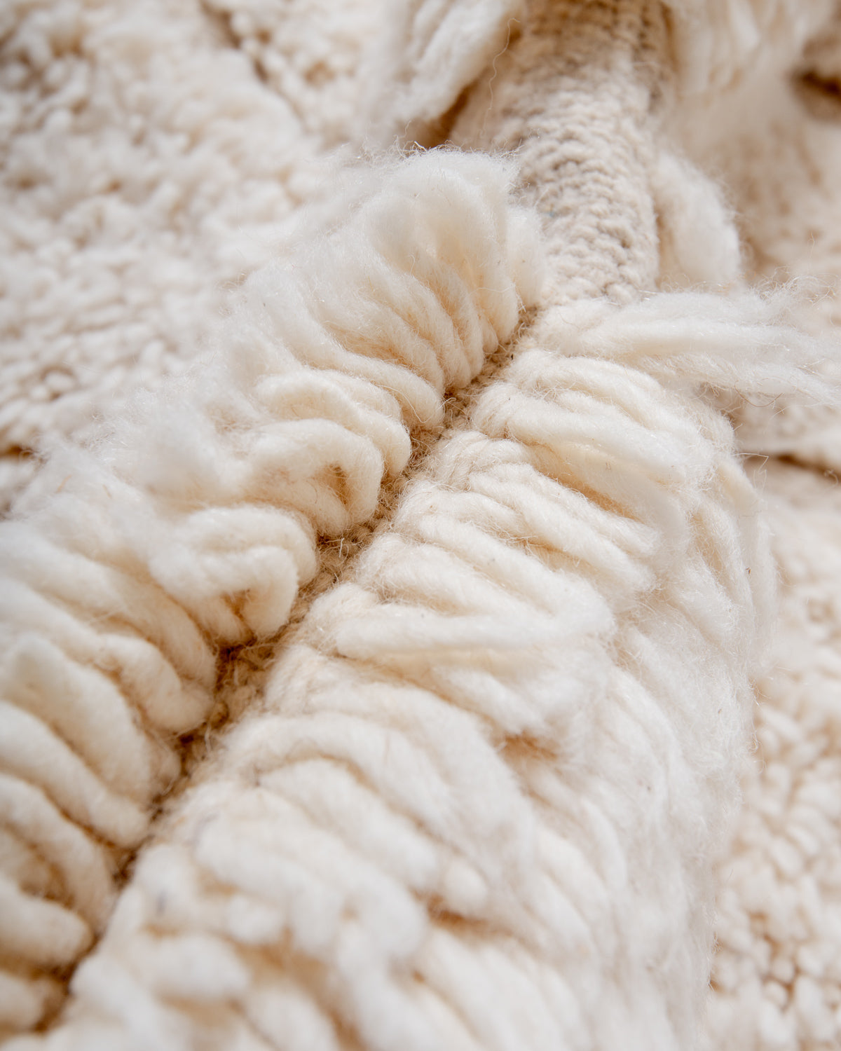 Modern, designer, handcrafted Berber rug from Morocco. Beniourain carpet with minimalist design, natural wool pile and a fluffy texture.