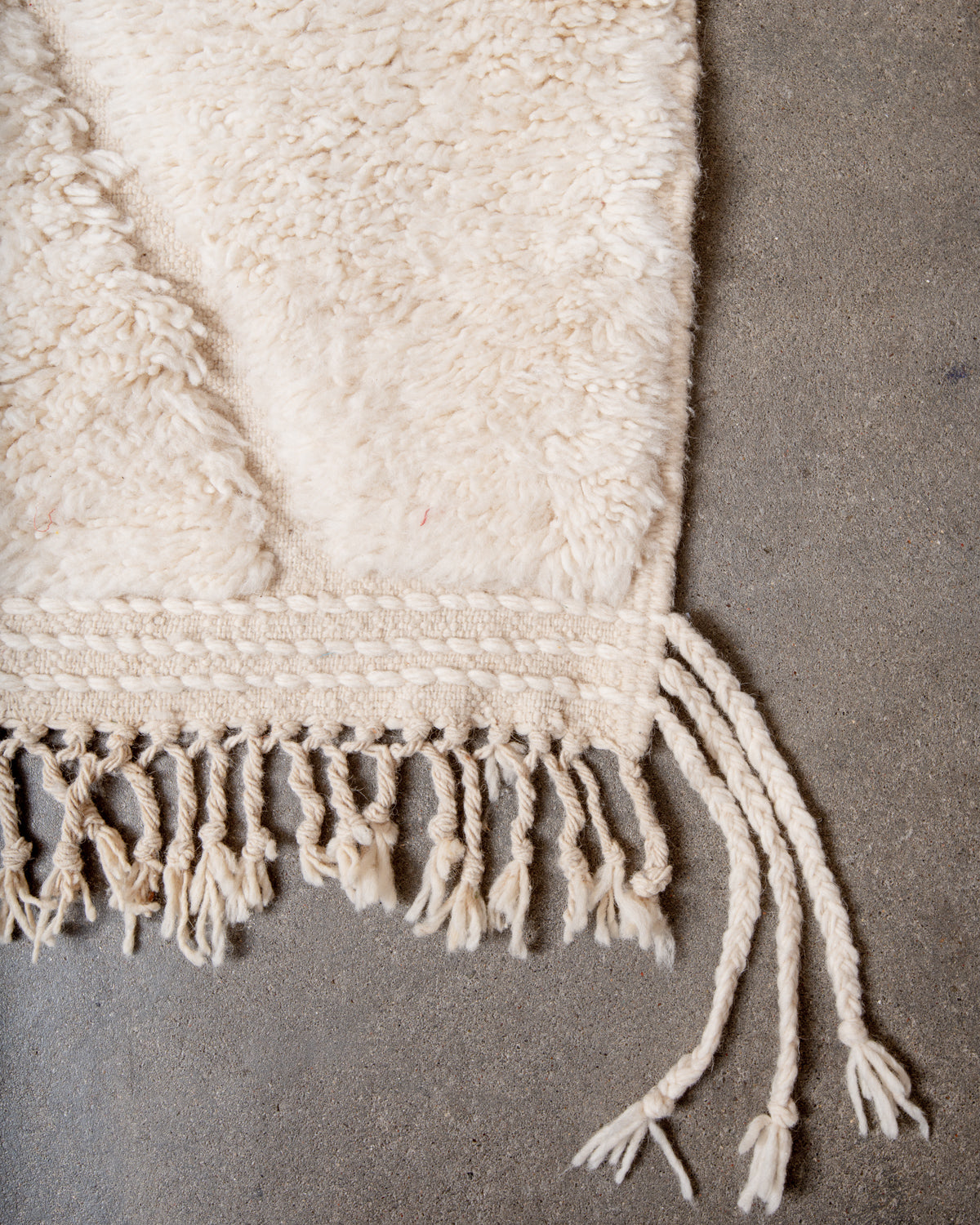 Modern, designer, handcrafted Berber rug from Morocco. Beniourain carpet with minimalist design, natural wool pile and a fluffy texture.