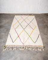 Modern, designer, handcrafted Berber rug from Morocco. Beniourain carpet with beautiful colours and patterns and fluffy wool texture.