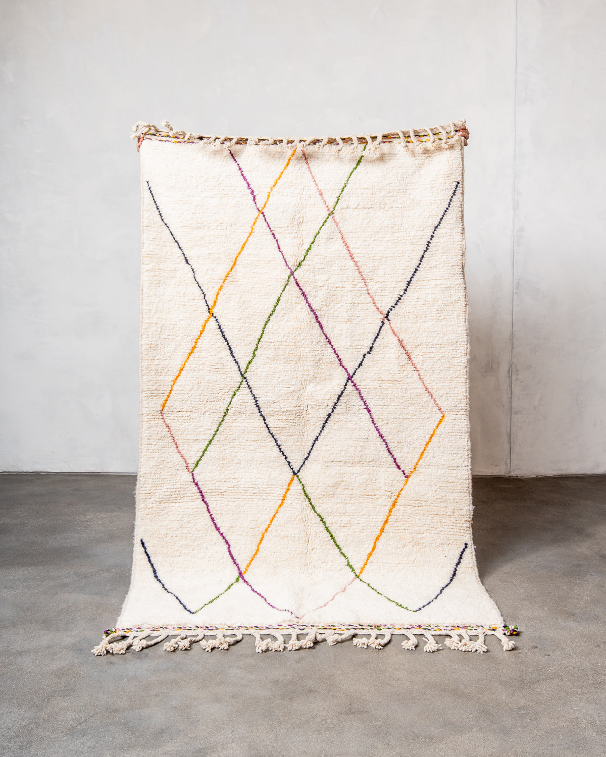 Modern, designer, handcrafted Berber rug from Morocco. Beniourain carpet with beautiful colours and patterns and fluffy wool texture.