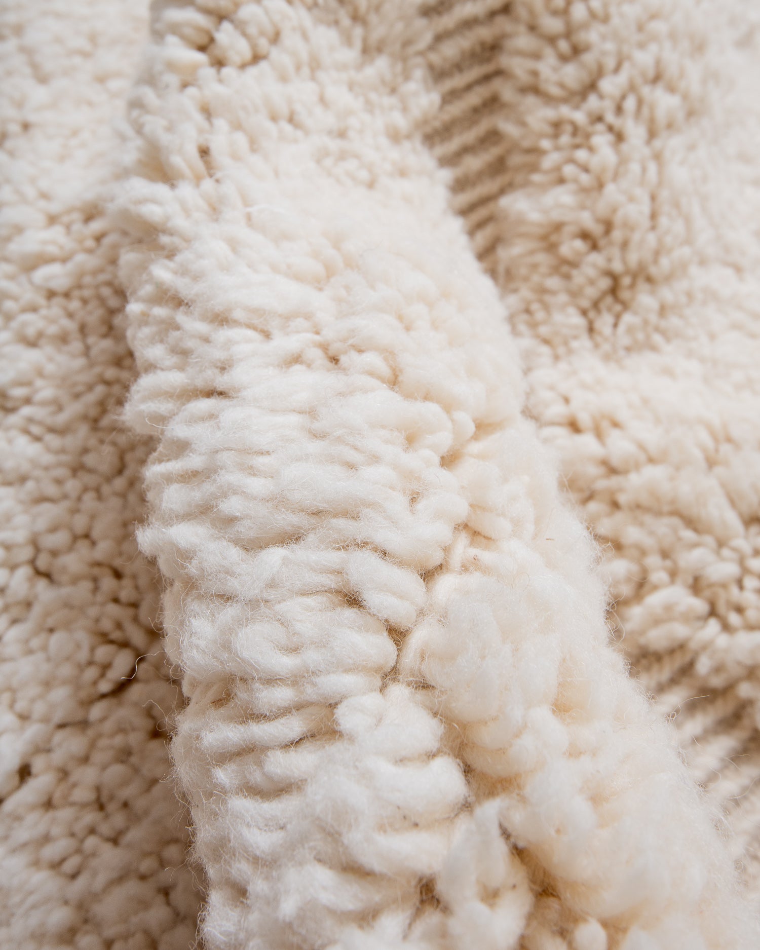 Modern, designer, handcrafted Berber rug from Morocco. Beniourain carpet with minimalist design, natural wool pile and a fluffy texture.