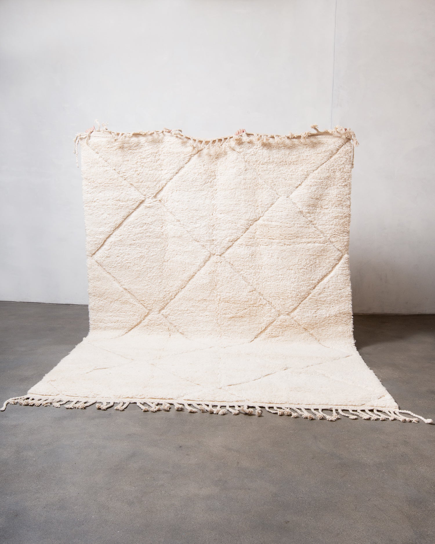 Modern, designer, handcrafted Berber rug from Morocco. Beniourain carpet with minimalist design, natural wool pile and a fluffy texture.