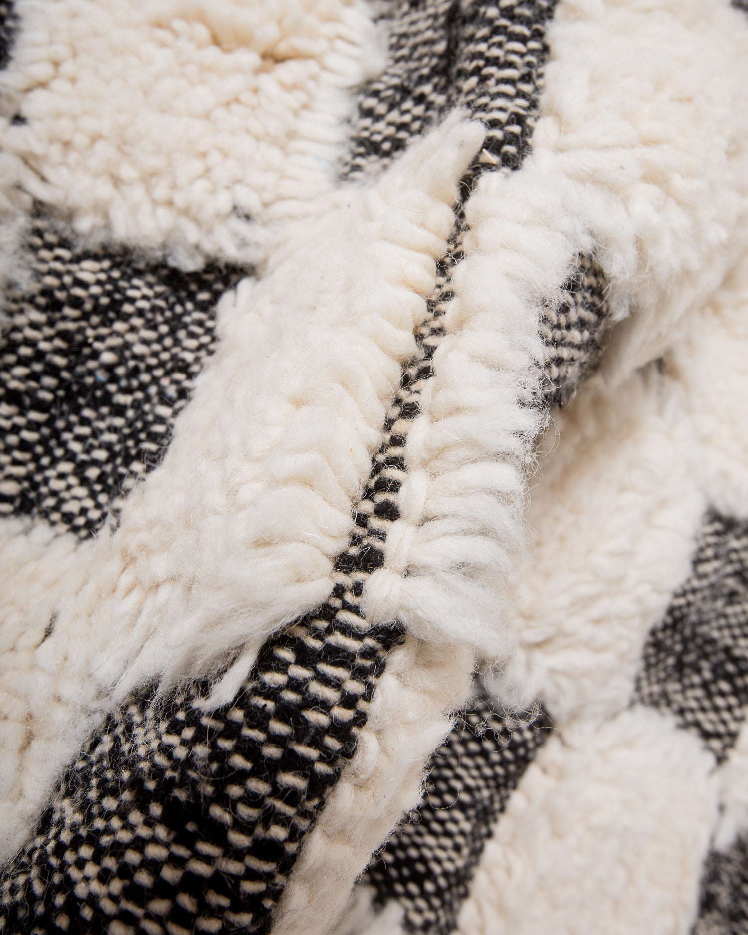 Modern, designer, handcrafted Berber rug from Morocco. Beniourain carpet with minimalist design, natural wool pile and a fluffy texture.