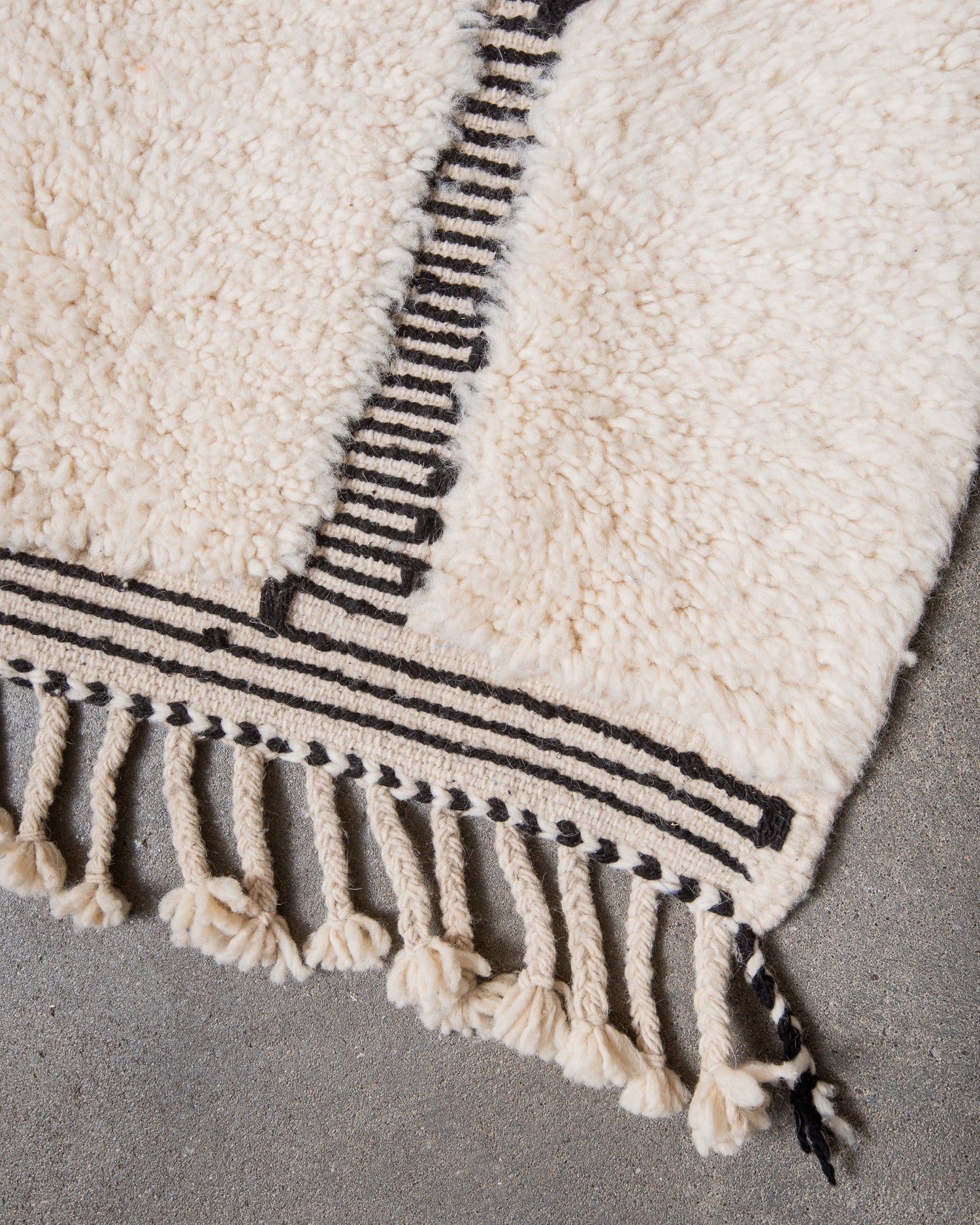 Modern, designer, handcrafted Berber rug from Morocco. Beniourain carpet with minimalist design, natural wool pile and a fluffy texture.