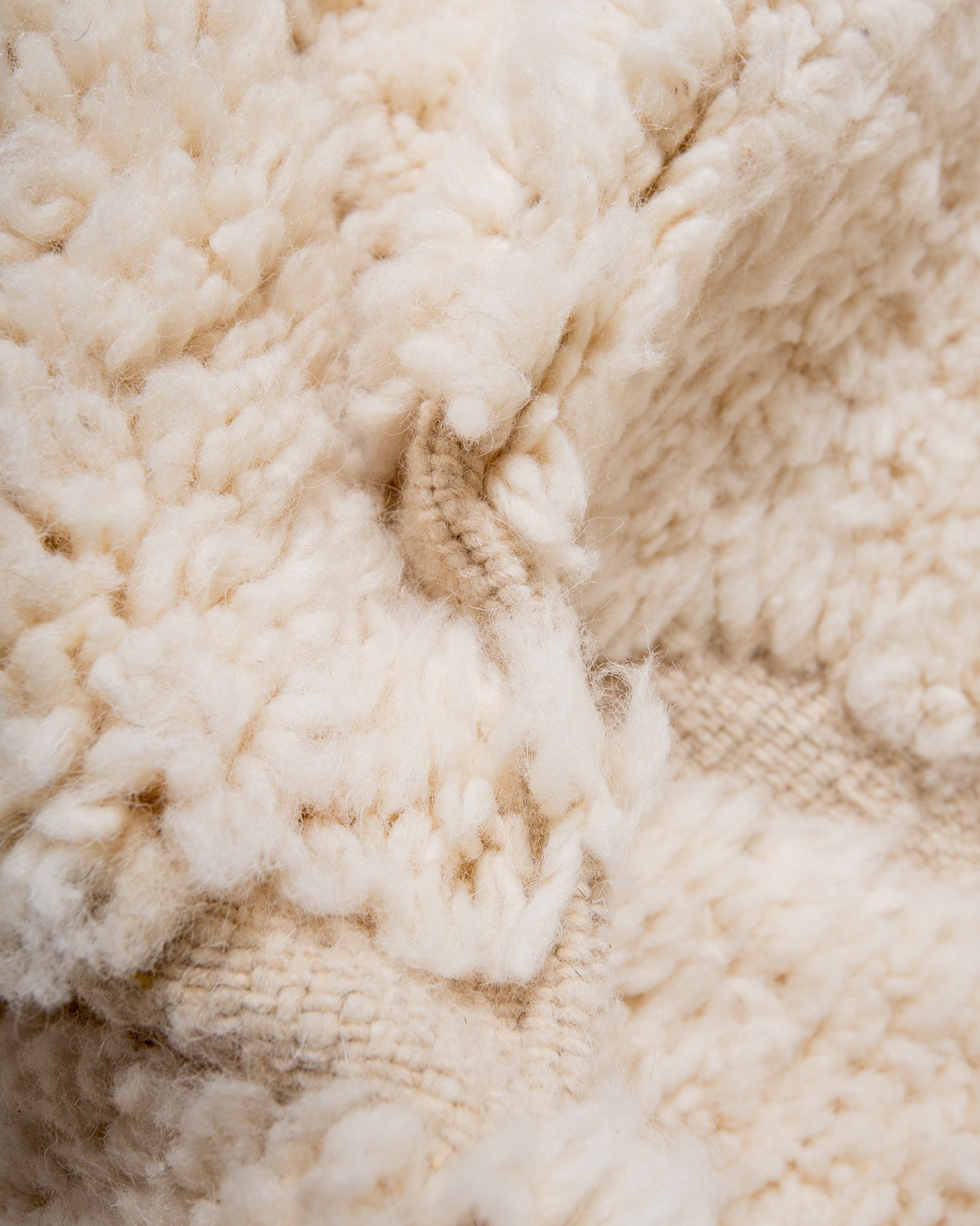 Modern, designer, handcrafted Berber rug from Morocco. Beniourain carpet with minimalist design, natural wool pile and a fluffy texture.