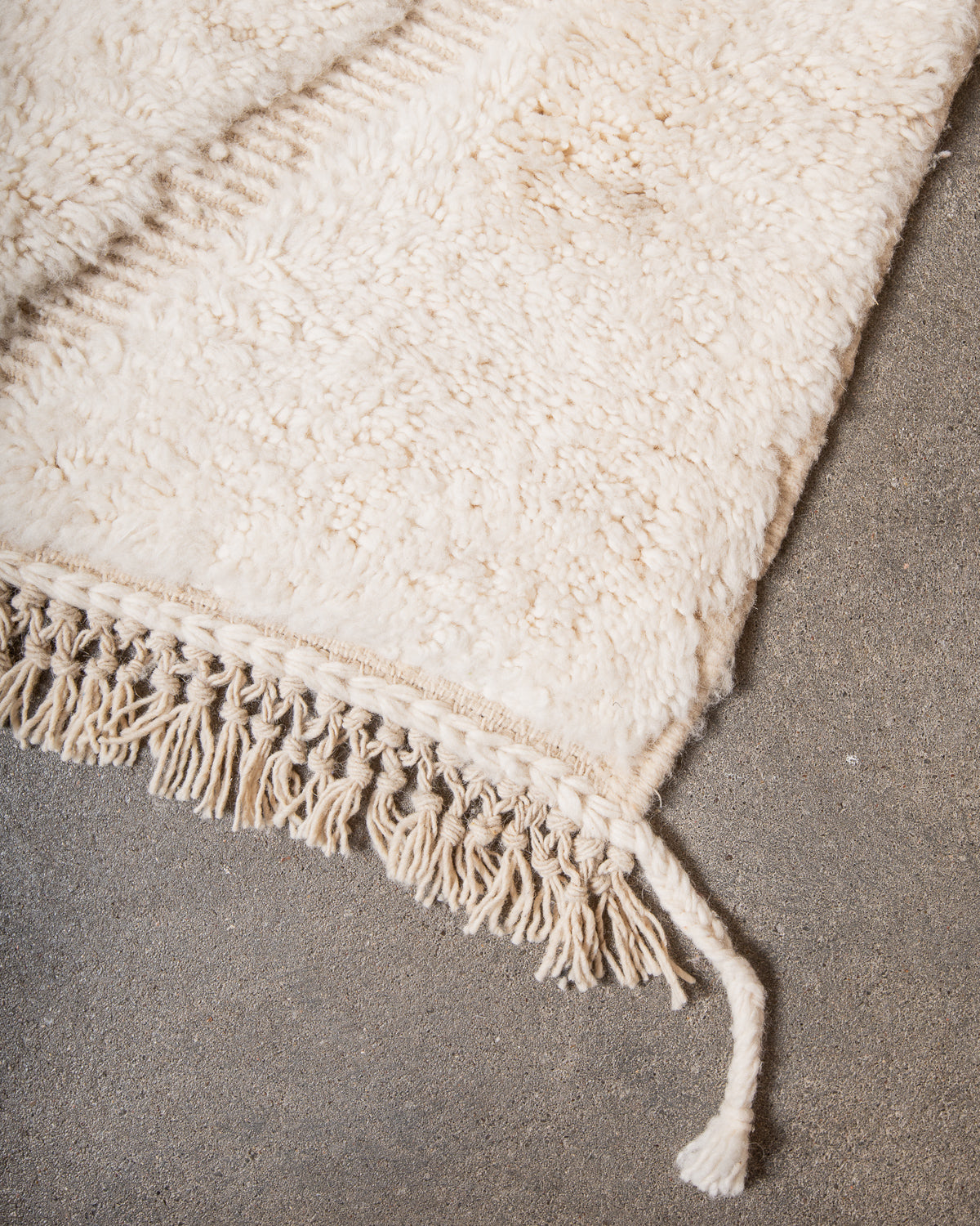 Modern, designer, handcrafted Berber rug from Morocco. Beniourain carpet with minimalist design, natural wool pile and a fluffy texture.